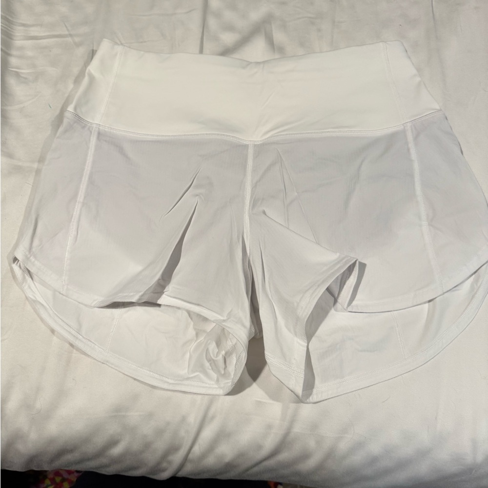Lululemon Athletica White Athletic Shorts with Back Zip Pocket. Size 6